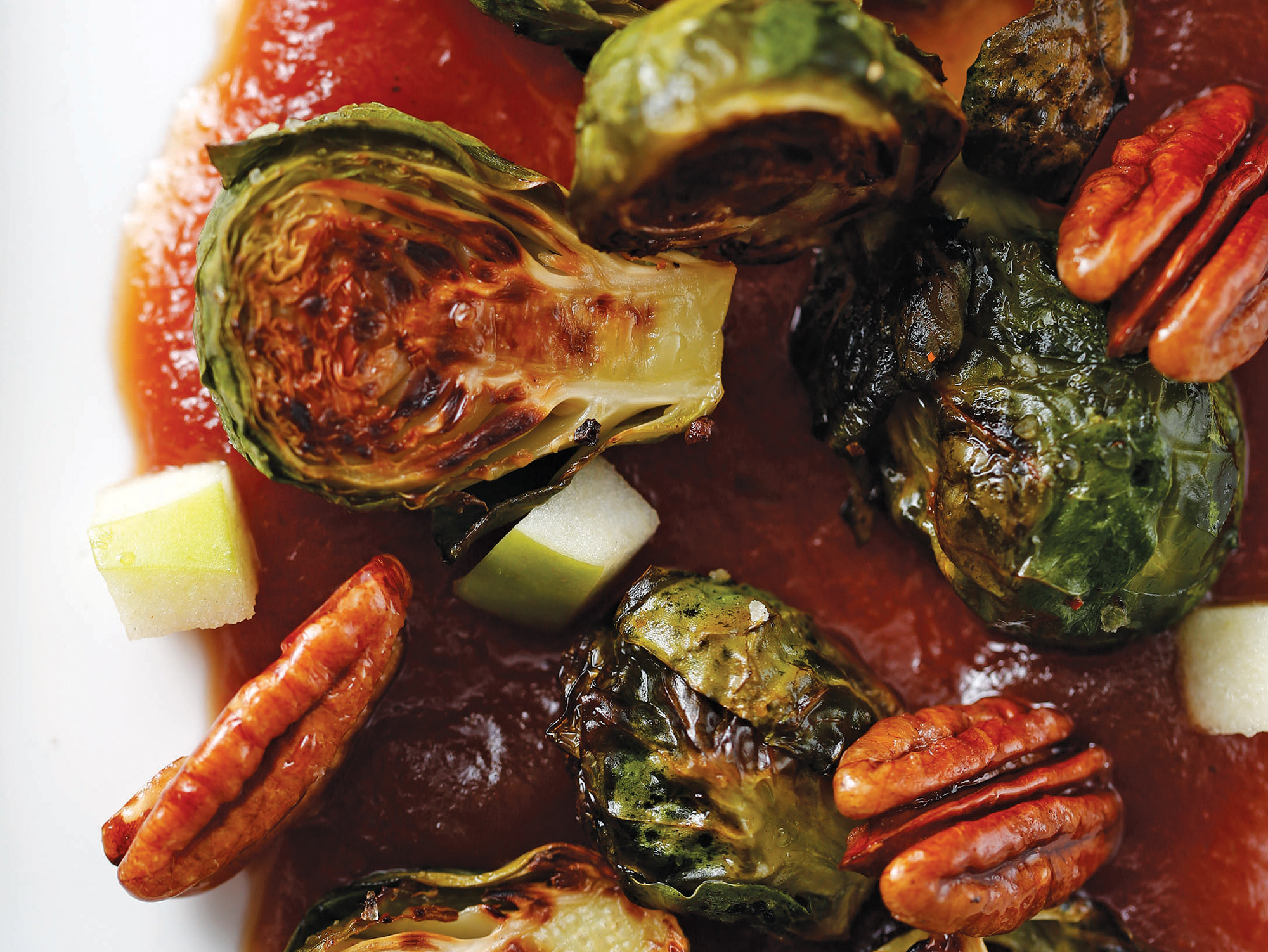 Apples and crunchy sweet pecans perk up baked Brussels sprouts.