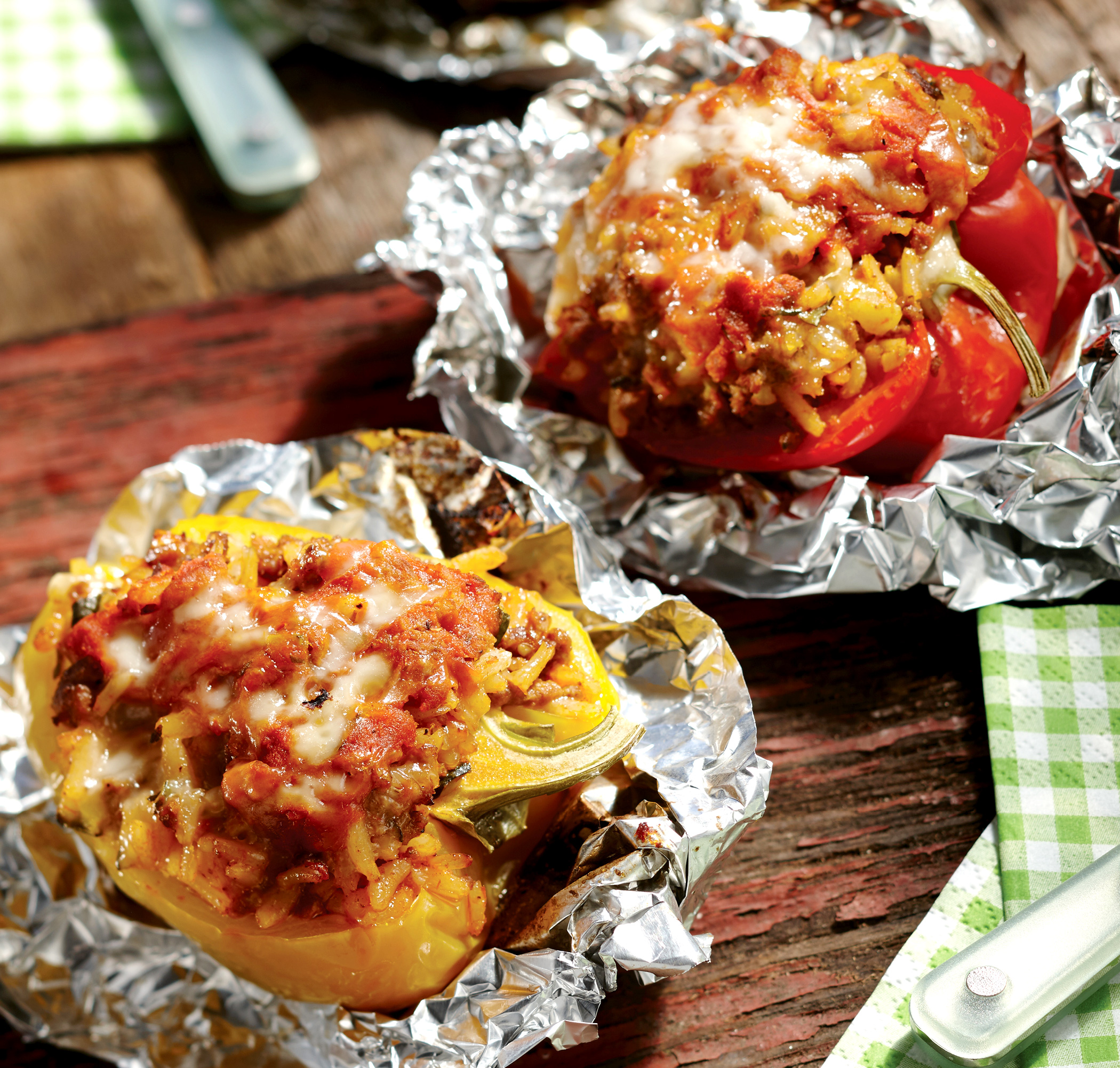 Colorful bell peppers are stuffed with Italian-style beef and rice in foil packets.