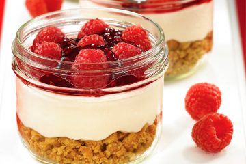 Luscious layers of graham crackers, raspberries, and cheesecake make a mouthwatering dessert.