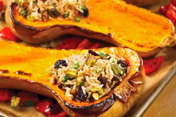 Savory stuffing of brown rice, dried cherries, and nuts lifts butternut squash to a new level.