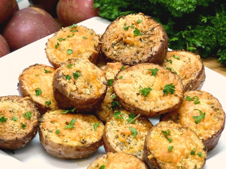 Crispy, golden red potatoes are spices with Italian herbs and topped with two cheeses.