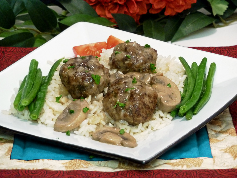 Flavorful sausage meatballs in an incredibly rich mushroom gravy are perfect over rice, pasta, or couscous.