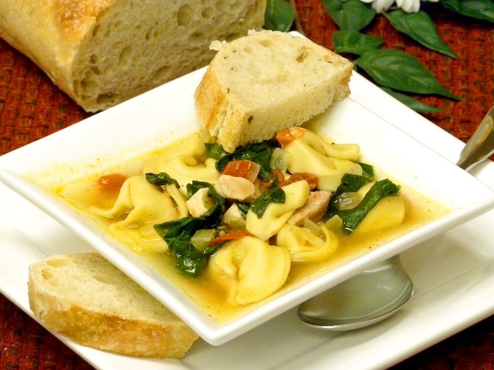 Chicken spinach tortellini soup is a colorful, filling meal in a bowl.