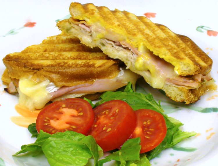 The Cuban sandwich goes gourmet with sun-dried tomato ham and brie cheese. Drool!