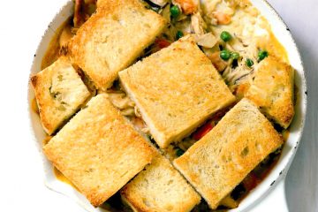 Skillet Chicken Mushroom Potpie is a yummy upscale version of the classic with shiitake mushrooms and crunchy bread topping.
