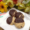 Peanut Butter Meltaway Cookies Recipe: Peanut butter cookies dipped in chocolate melt in your mouth.